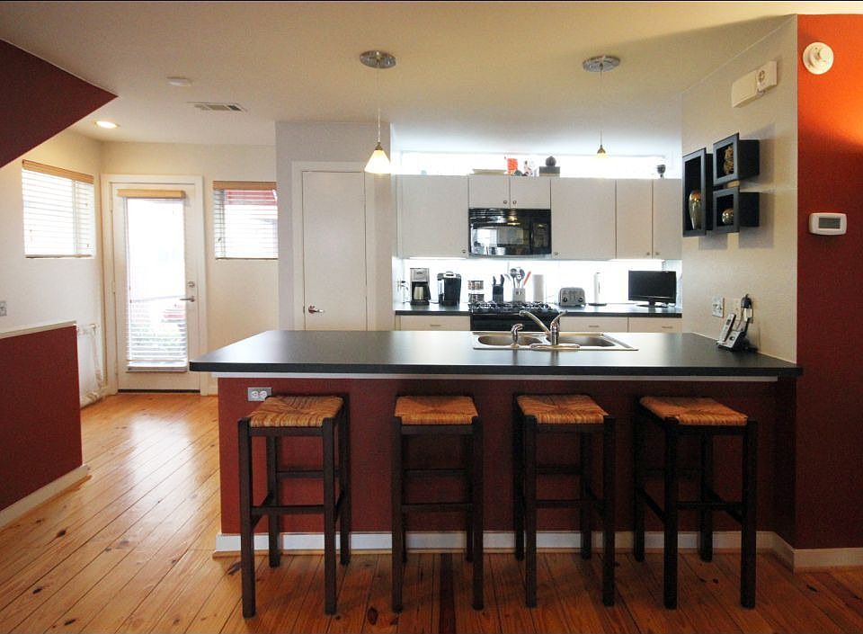 Open kitchen with counter seating and lots of storage
