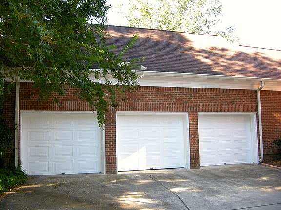 Triple Garages with Room Ove