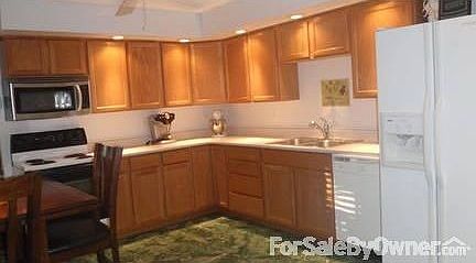Kitchen view from door.
						:
						Large eat in kitchen. Patio located directly off kitchen door.