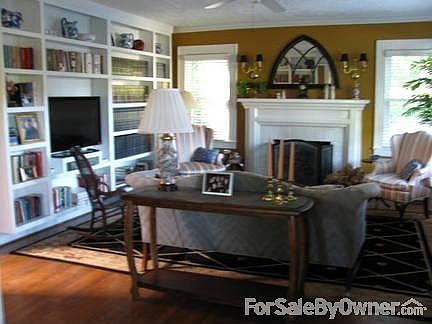 Living Area
						:
						Features hardwood floors, gas log fireplace and beautiful built-in bookshelves.
