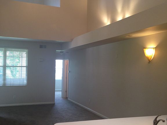 Living room. Vaulted ceilings. New lighting. Ceiling fan.