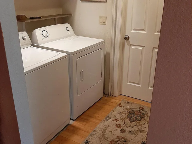 Washer and dryer adjacent to master bedroom