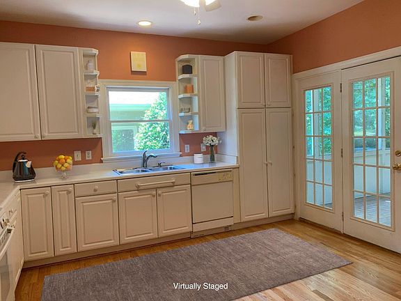 Kitchen has TONS of cabinet & counter space PLUS room for a table. Pantry cupboard has pull out shelves. All appliances including built in microwave.
