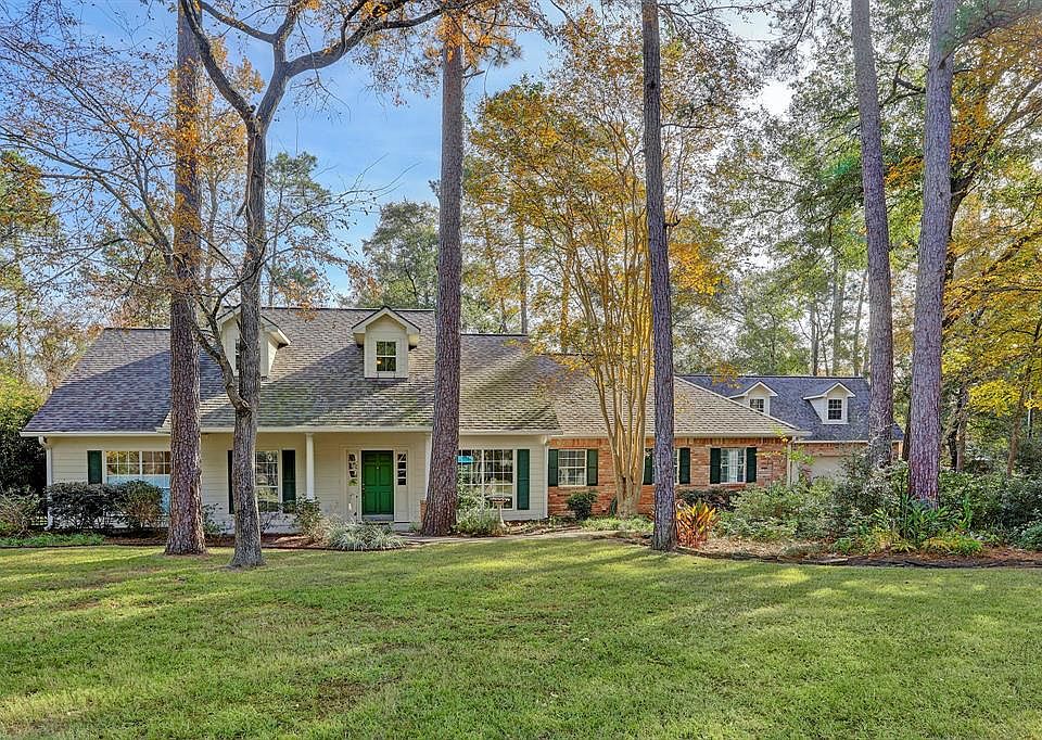Beautiful, traditional style home sits on one lush, landscaped acre of land.