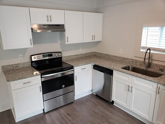 The house features a brand new kitchen, complete with new stainless steel appliances, granite countertops, and white shaker cabinets.