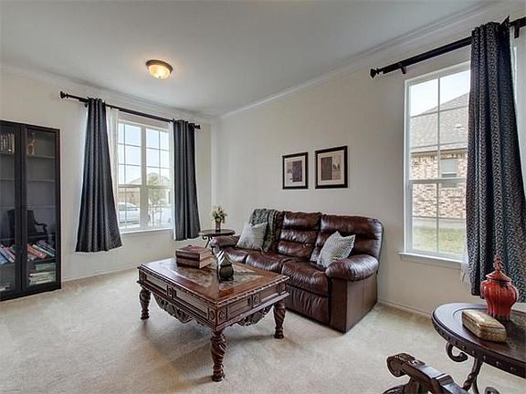 The formal living room is an ideal room to greet and entertain guests.