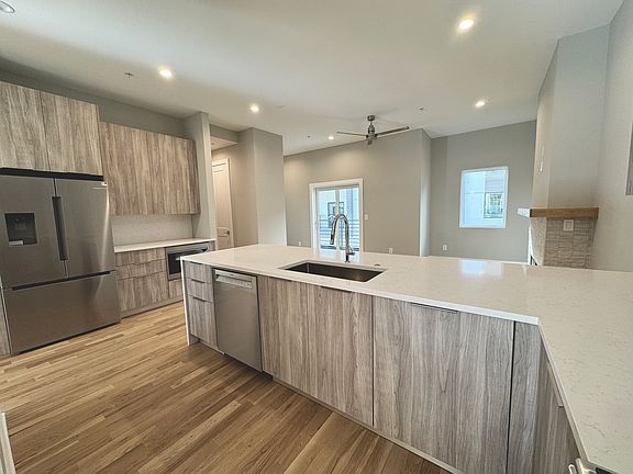 kitchen and living room, featuring Porecelanosa fixtures and cabinetry