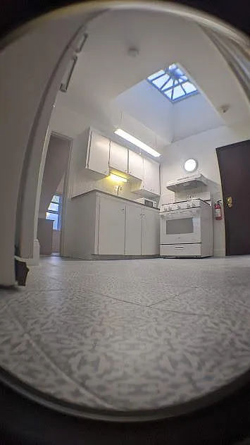 Kitchen view new ceramic floor, large sky window Natural light.