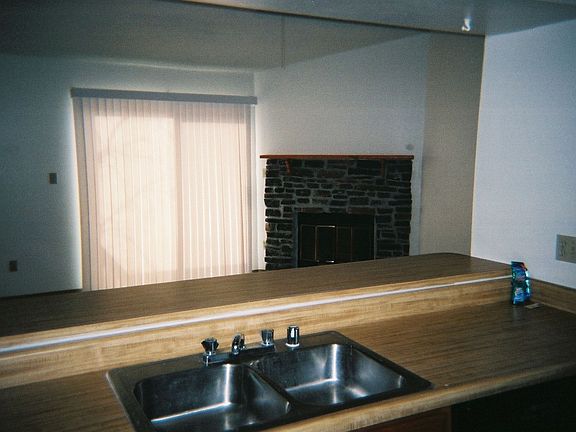 View of the new fireplace from open kitchen.