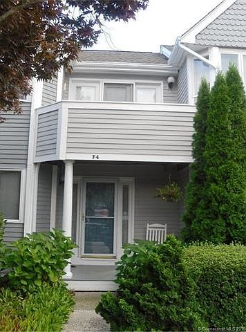 Exterior front view of unit shows front porch with master be