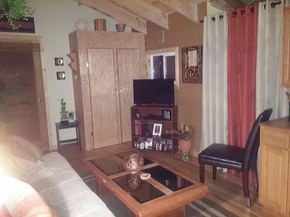 Living room with furniture and closet