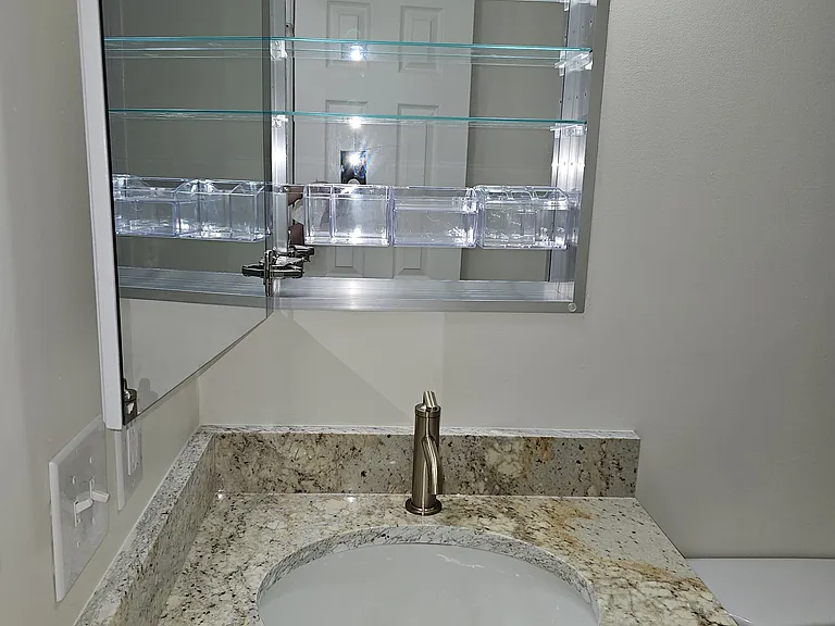 Beautiful, fully mirrored recessed cabinet for extra storage (both baths)