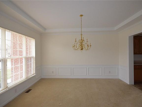 Triple window in the Formal Dining Room gives the room and "light and bright" feel.