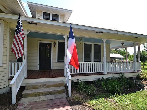Front doorway and porch inviting you inside.