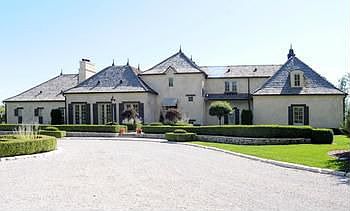 European inspired home with a functional design, intended to combine luxury, quality and utility. Approaching the house on the circle drive and passing the stately groomed Mediterranean landscaped yard you will arrive at the canopy covered front entry with gas flame lanterns. Splendid Ann Sachs Belgian limestone in the foyer. Cedar shake shingle roof and rolled copper eaves troughs. This house is rich in detail and too numerous to mention. 