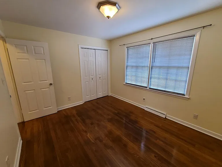 The third bedroom upstairs has a great view of the back yard.