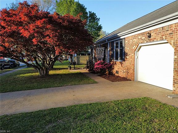 Gorgeous trees in the front give shade and privacy to the front porch!
