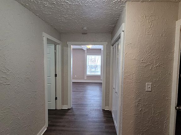 Entry foyer to first bedroom and living room.