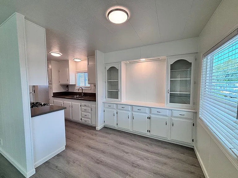 The kitchen is thoughtfully designed to blend functionality with everyday comfort. Featuring ample cabinetry and generous counter space, it provides plenty of room for meal preparation and storage.