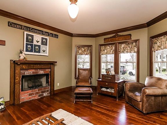 Living Room featuring custom brick fireplace, 2 piece crown molding. Cable is already wired for flatscreen tv above fireplace.