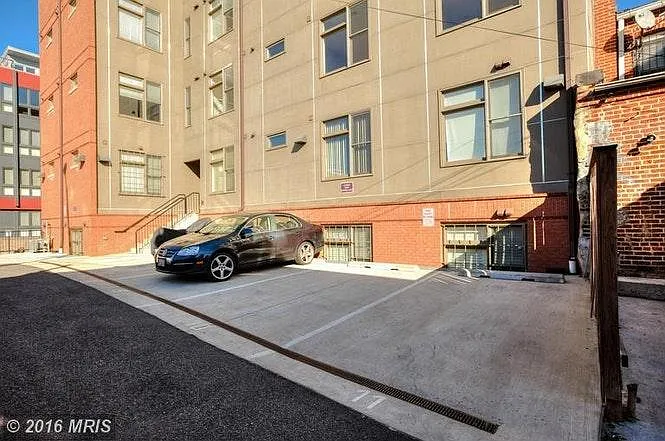 Parking spot out back of building (off street)