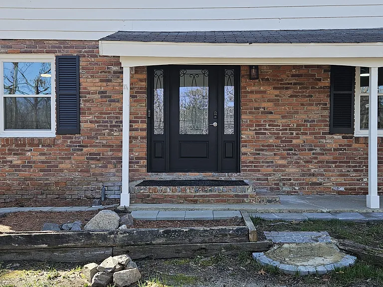 The front door reflects the house's curb appeal and welcomes visitors.