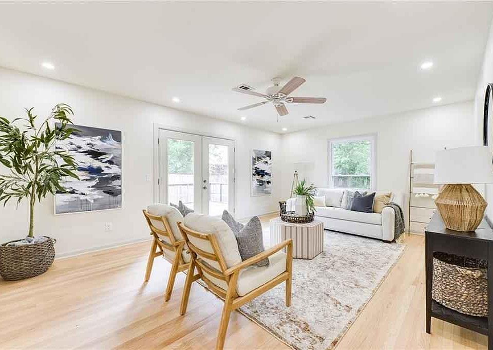 Beautiful natural hardwood floors, recessed lighting, ceiling fan, new energy efficient windows, and window treatments (not shown).
