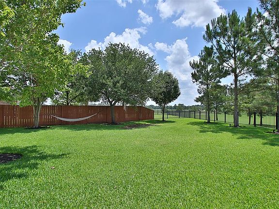 Supreme privacy from neighbors with both pine and deciduous trees.