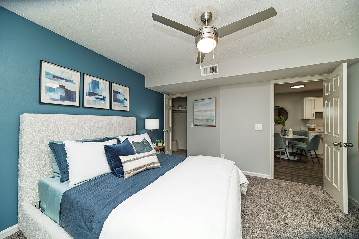 Bedroom with carpet & ceiling fan