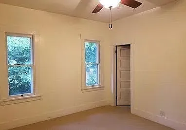 Bedroom on main floor, with views to side yard