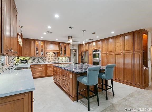 Newer kitchen with tiled backsplash, granite counter top, double oven and double sinks, double dishwasher, (can be a Kosher kitc
