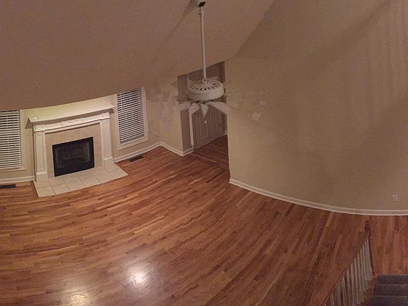 Great room view from loft, gas logs fireplace