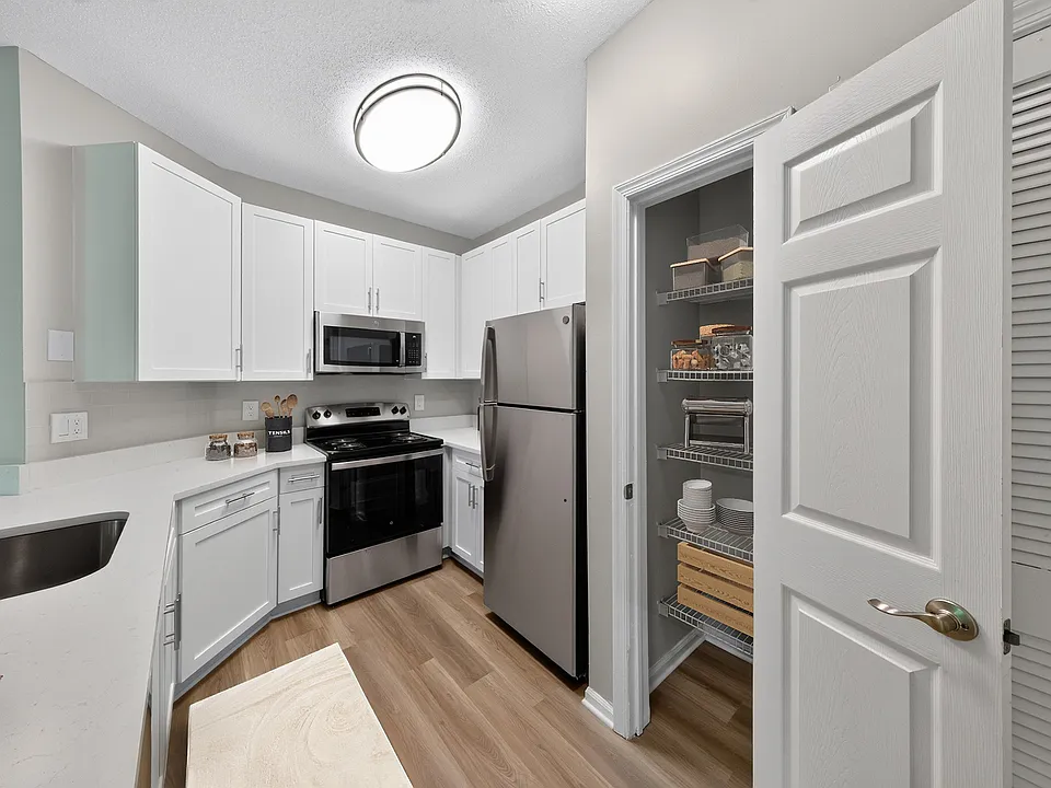 Step into the modern elegance of Eagle Rock Apartments at Belcamp with this sleek kitchen featuring stainless steel appliances and ample storage. Ideal for culinary enthusiasts and casual cooks alike. Schedule your tour today!