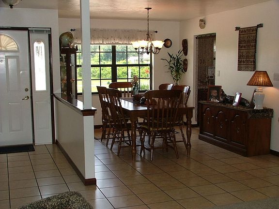 Open plan dining room with new tile floor