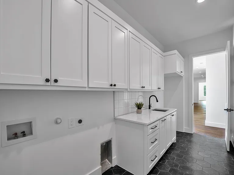 Laundry room with sink and second pantry