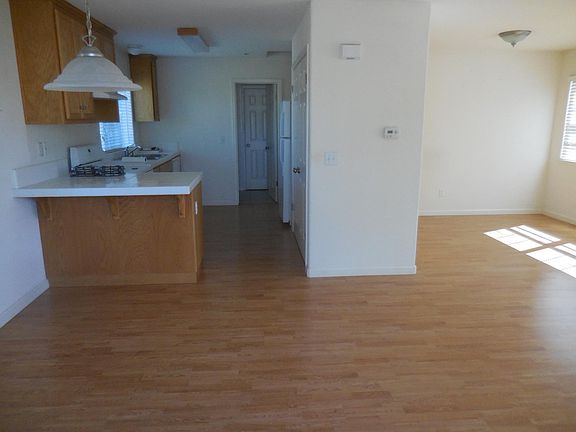 Living room to right, kitchen head on