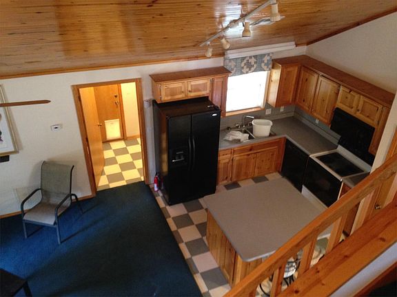 View from the upstairs bedroom overlooking the Kitchen and L