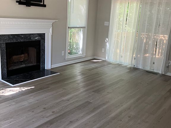 Slider doors to deck and fenced back yard.