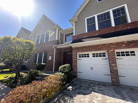 ATTACHED GARAGE AND LONG DRIVEWAY