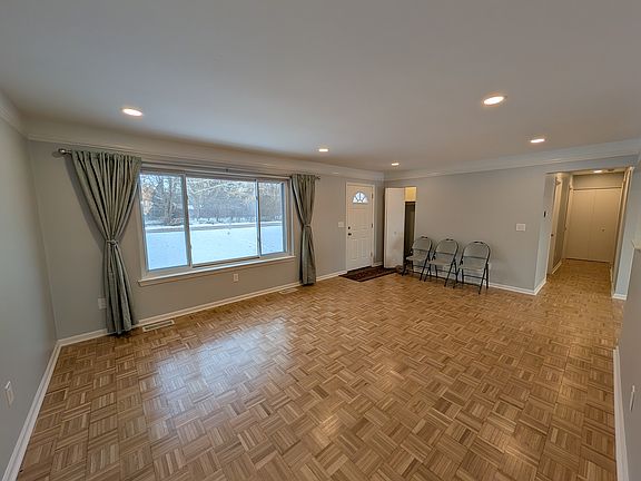 Natural light floods the living room! Controled lighting! Refinished hardwood floors.