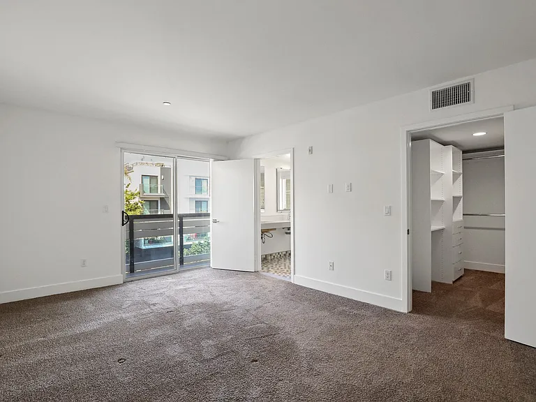 Bedroom with Walk-In Closet and Balcony