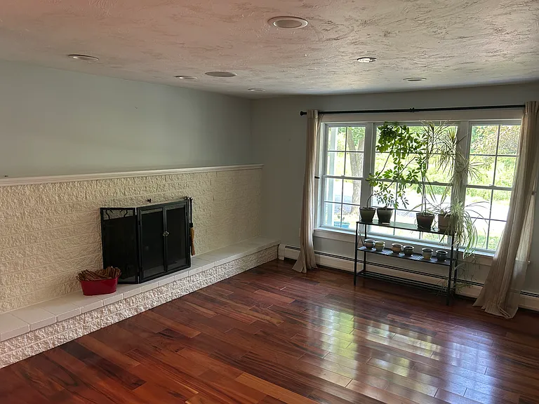 Living room with 1 of 2 fireplaces