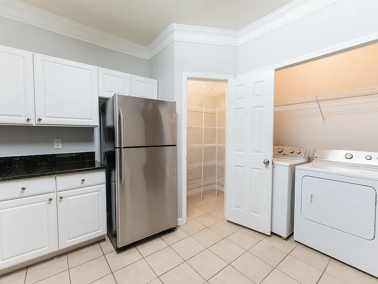 kitchen with pantry and washer/dryer in unit