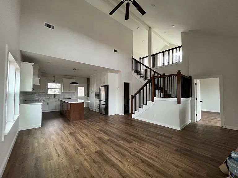Large living room, with view of upstairs loft and Bedroom #3