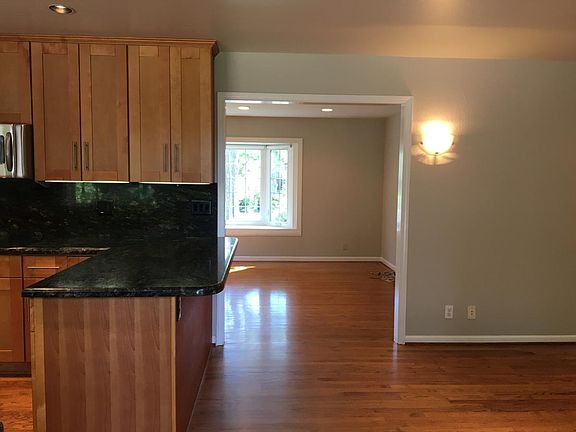 Looking in from the sliding glass door at the Kitchen, Dinin