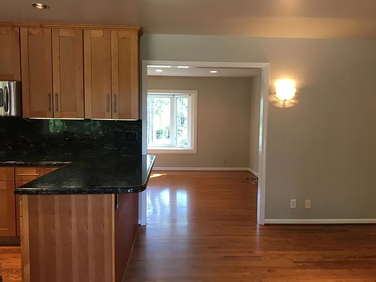 Looking in from the sliding glass door at the Kitchen, Dinin