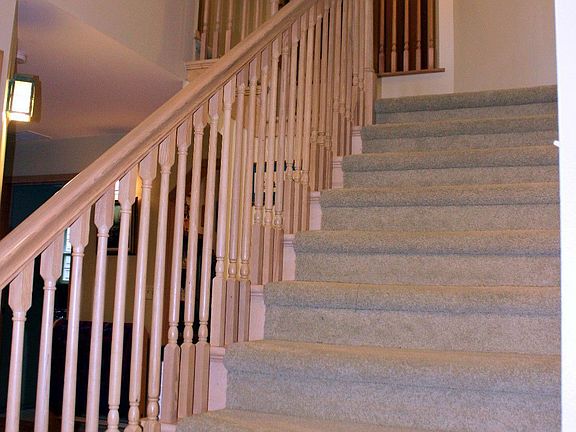 gracious stair with wood railing