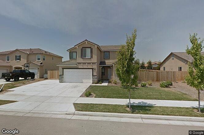 Notice extra cement driveway for more parking