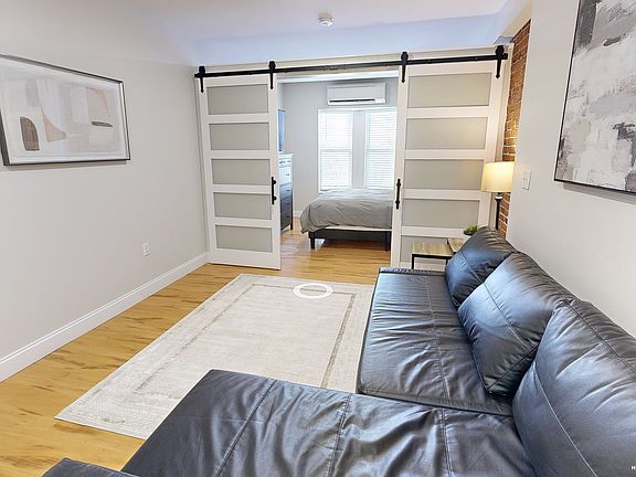 Living room area w pull out sleeper sofa. Not pictured : 55" wall mounted smartTV