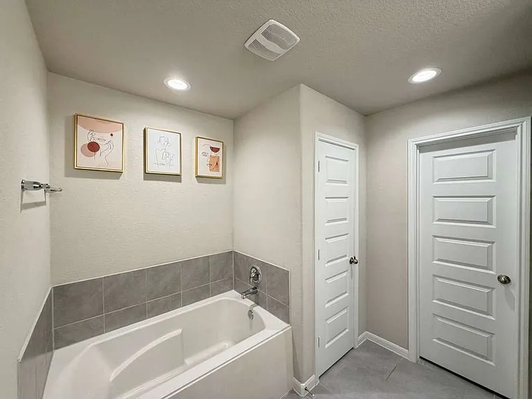 Separate tub and shower in primary bathroom
